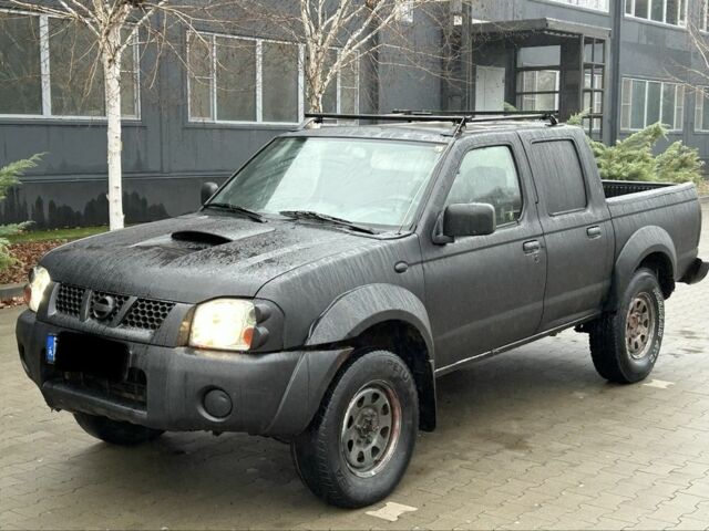 Черный Ниссан Навара, объемом двигателя 2.5 л и пробегом 200 тыс. км за 3450 $, фото 1 на Automoto.ua