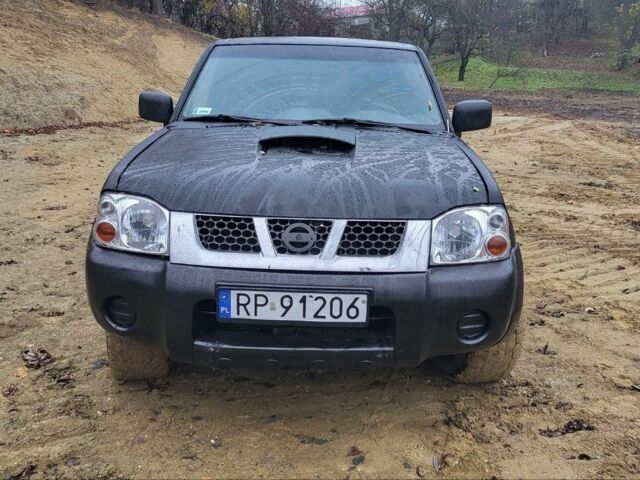 Черный Ниссан Навара, объемом двигателя 2.5 л и пробегом 238 тыс. км за 2750 $, фото 1 на Automoto.ua