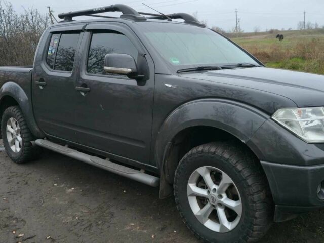 Черный Ниссан Навара, объемом двигателя 2.5 л и пробегом 240 тыс. км за 8600 $, фото 1 на Automoto.ua