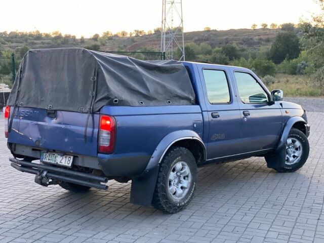 Синій Ніссан Навара, об'ємом двигуна 2.5 л та пробігом 250 тис. км за 4003 $, фото 1 на Automoto.ua