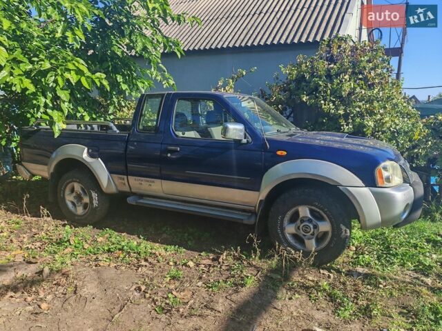 Синий Ниссан Навара, объемом двигателя 2.5 л и пробегом 253 тыс. км за 5000 $, фото 1 на Automoto.ua
