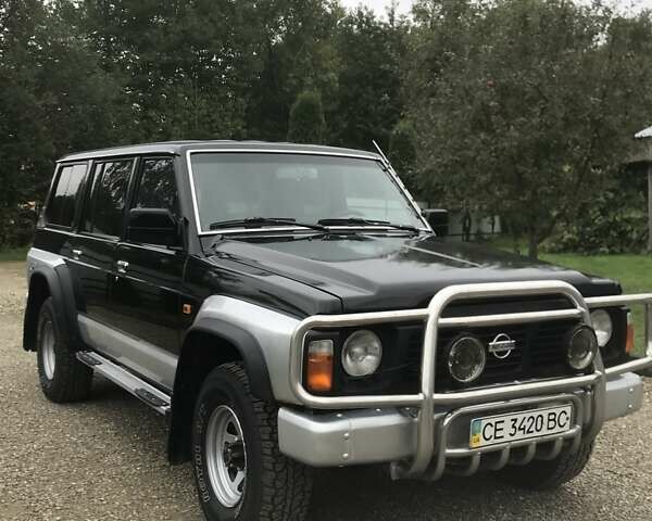Чорний Ніссан Патрол, об'ємом двигуна 2.8 л та пробігом 306 тис. км за 12000 $, фото 1 на Automoto.ua