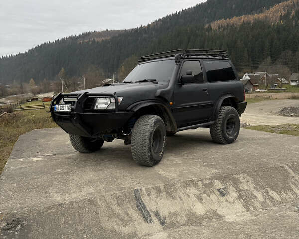 Чорний Ніссан Патрол, об'ємом двигуна 2.83 л та пробігом 307 тис. км за 14800 $, фото 1 на Automoto.ua