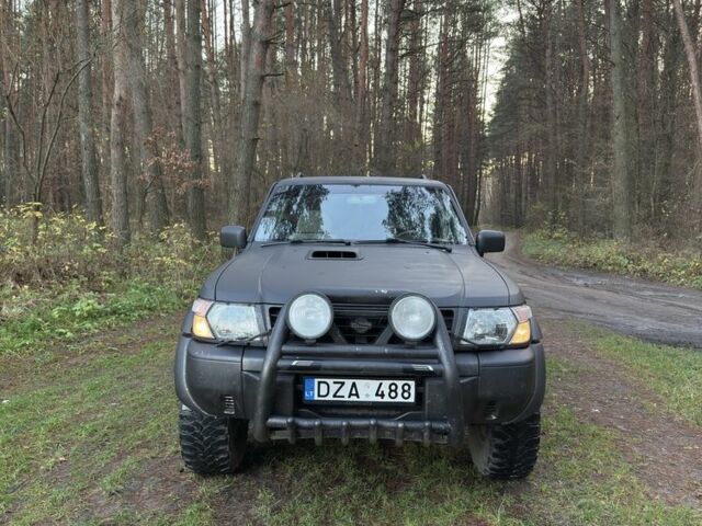 Черный Ниссан Патрол, объемом двигателя 3 л и пробегом 251 тыс. км за 9000 $, фото 1 на Automoto.ua