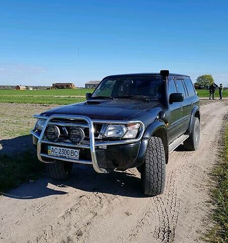 Чорний Ніссан Патрол, об'ємом двигуна 3 л та пробігом 259 тис. км за 11000 $, фото 1 на Automoto.ua