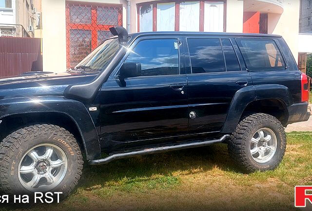 Чорний Ніссан Патрол, об'ємом двигуна 3 л та пробігом 232 тис. км за 12700 $, фото 1 на Automoto.ua