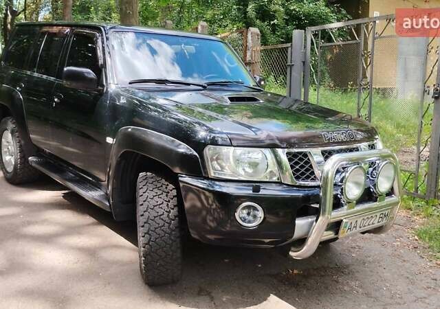 Черный Ниссан Патрол, объемом двигателя 3 л и пробегом 230 тыс. км за 23500 $, фото 1 на Automoto.ua