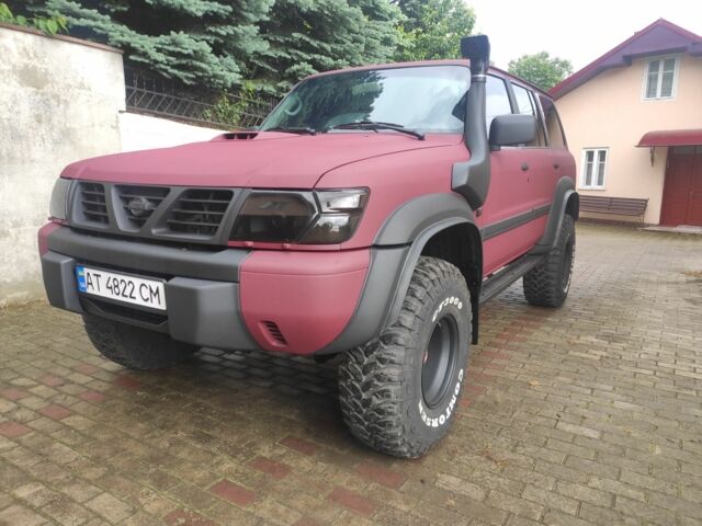 Красный Ниссан Патрол, объемом двигателя 3 л и пробегом 250 тыс. км за 35000 $, фото 1 на Automoto.ua