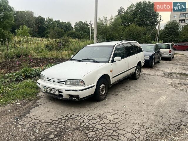Белый Ниссан Примера, объемом двигателя 2 л и пробегом 450 тыс. км за 401 $, фото 1 на Automoto.ua