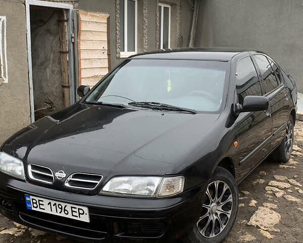 Чорний Ніссан Прімера, об'ємом двигуна 2 л та пробігом 320 тис. км за 2500 $, фото 1 на Automoto.ua