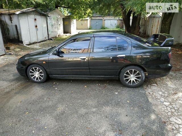 Черный Ниссан Примера, объемом двигателя 2 л и пробегом 234 тыс. км за 1999 $, фото 1 на Automoto.ua