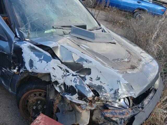 Серый Ниссан Примера, объемом двигателя 0 л и пробегом 240 тыс. км за 473 $, фото 1 на Automoto.ua