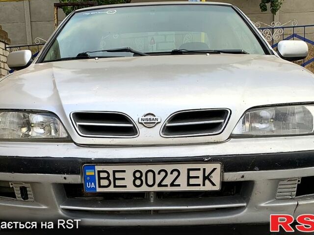 Сірий Ніссан Прімера, об'ємом двигуна 2 л та пробігом 300 тис. км за 2000 $, фото 1 на Automoto.ua