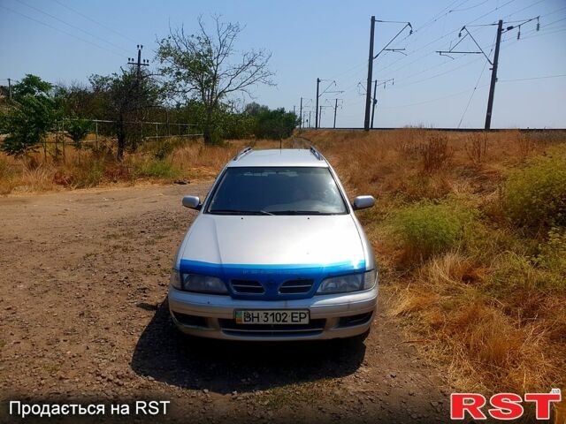 Серый Ниссан Примера, объемом двигателя 2 л и пробегом 350 тыс. км за 1800 $, фото 1 на Automoto.ua