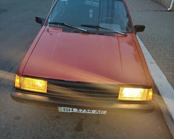 Красный Ниссан Санни, объемом двигателя 1.5 л и пробегом 318 тыс. км за 950 $, фото 1 на Automoto.ua