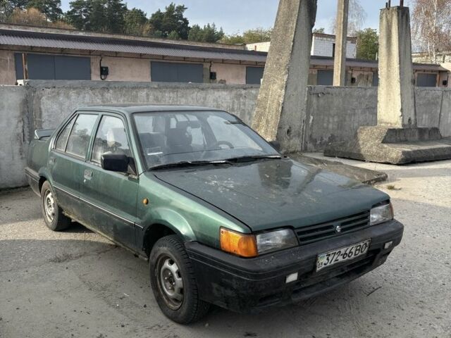 Зелений Ніссан Санні, об'ємом двигуна 1.4 л та пробігом 400 тис. км за 850 $, фото 1 на Automoto.ua