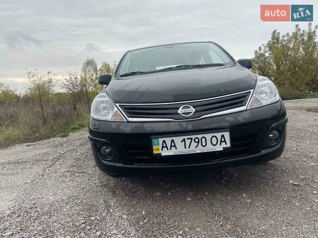 Черный Ниссан Тиида, объемом двигателя 1.6 л и пробегом 60 тыс. км за 9600 $, фото 1 на Automoto.ua