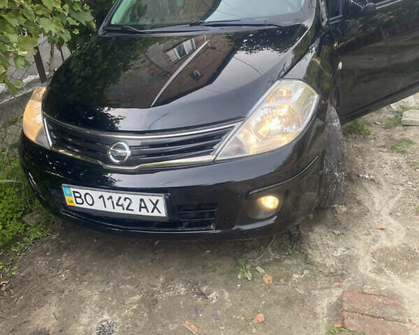 Черный Ниссан Тиида, объемом двигателя 1.6 л и пробегом 182 тыс. км за 3250 $, фото 1 на Automoto.ua