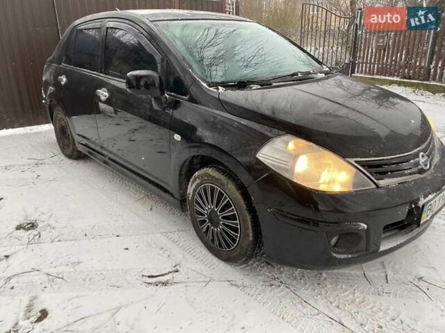 Черный Ниссан Тиида, объемом двигателя 1.6 л и пробегом 182 тыс. км за 3200 $, фото 1 на Automoto.ua