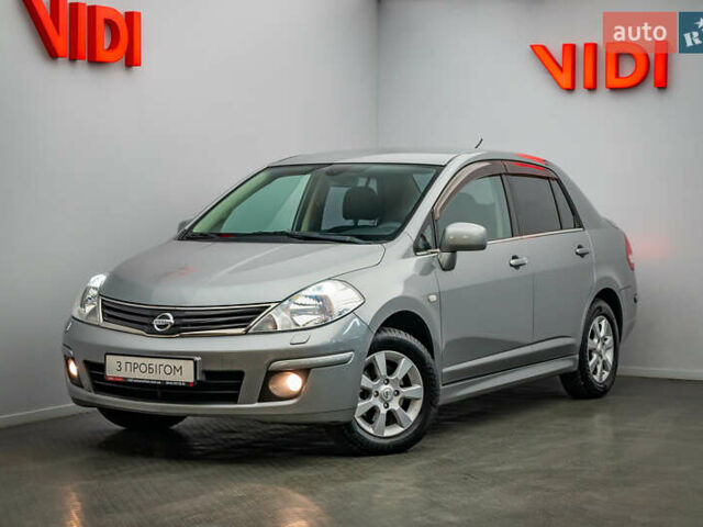Серый Ниссан Тиида, объемом двигателя 1.6 л и пробегом 166 тыс. км за 6997 $, фото 1 на Automoto.ua
