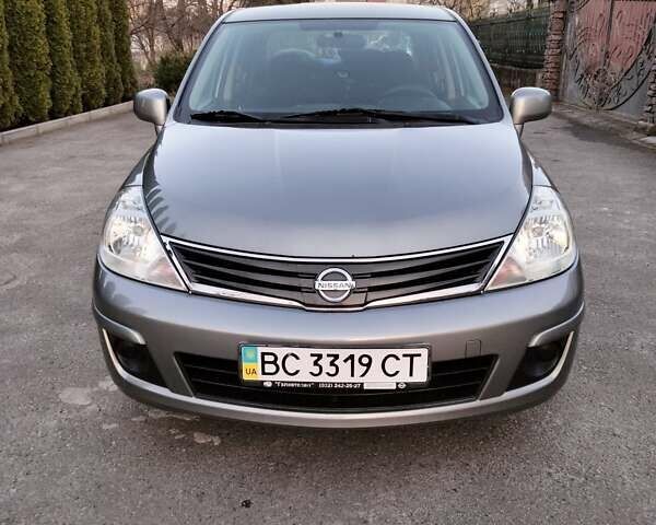 Серый Ниссан Тиида, объемом двигателя 1.6 л и пробегом 123 тыс. км за 7500 $, фото 1 на Automoto.ua
