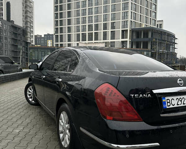 Черный Ниссан Теана, объемом двигателя 2.35 л и пробегом 321 тыс. км за 5050 $, фото 1 на Automoto.ua