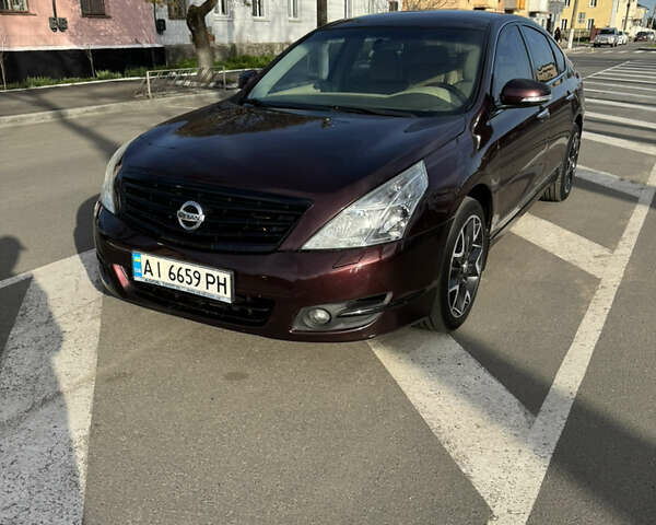 Красный Ниссан Теана, объемом двигателя 2.3 л и пробегом 193 тыс. км за 6299 $, фото 1 на Automoto.ua