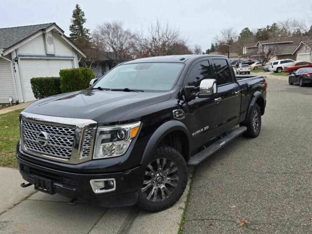 Черный Ниссан Титан, объемом двигателя 5.5 л и пробегом 150 тыс. км за 25000 $, фото 1 на Automoto.ua