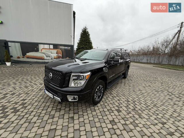 Чорний Ніссан Титан, об'ємом двигуна 5 л та пробігом 79 тис. км за 52000 $, фото 1 на Automoto.ua