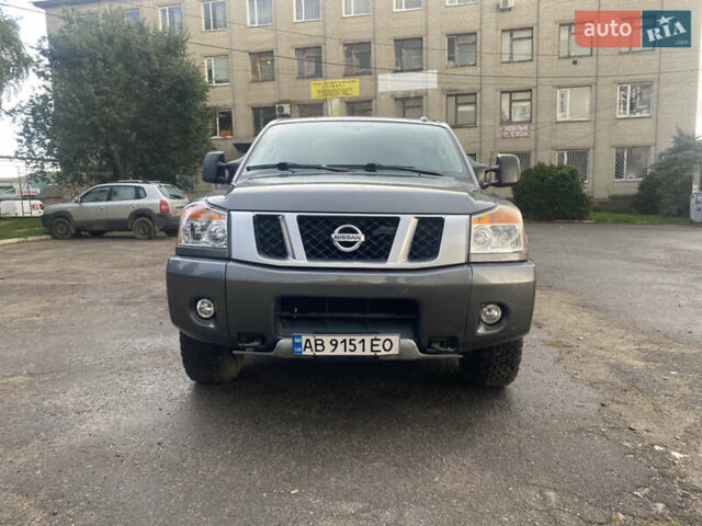 Серый Ниссан Титан, объемом двигателя 5.55 л и пробегом 143 тыс. км за 19500 $, фото 1 на Automoto.ua