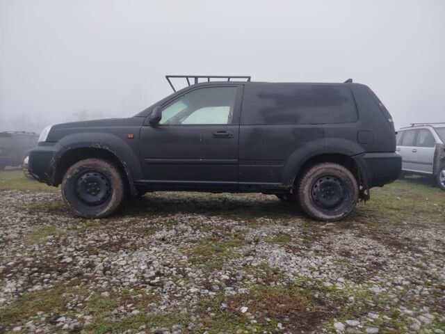 Черный Ниссан ИксТрейл, объемом двигателя 2.2 л и пробегом 300 тыс. км за 3000 $, фото 1 на Automoto.ua