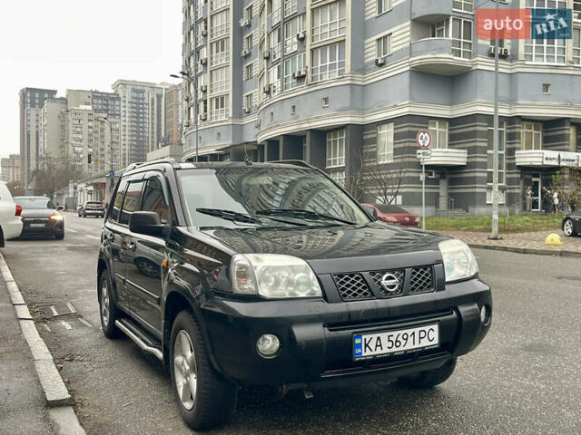 Черный Ниссан ИксТрейл, объемом двигателя 2 л и пробегом 320 тыс. км за 5600 $, фото 1 на Automoto.ua
