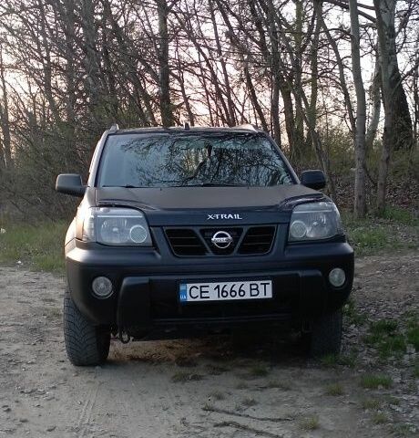 Черный Ниссан ИксТрейл, объемом двигателя 2 л и пробегом 380 тыс. км за 6500 $, фото 1 на Automoto.ua