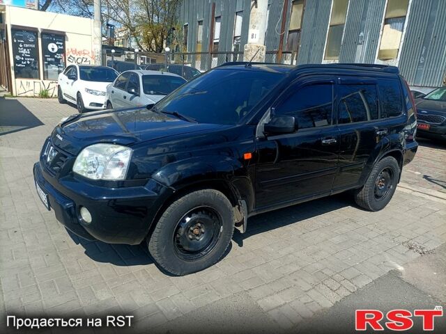 Черный Ниссан ИксТрейл, объемом двигателя 2.2 л и пробегом 333 тыс. км за 6500 $, фото 1 на Automoto.ua