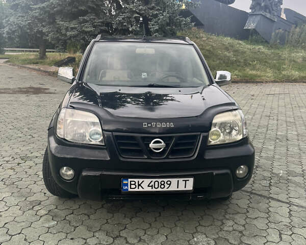 Черный Ниссан ИксТрейл, объемом двигателя 2.2 л и пробегом 356 тыс. км за 6000 $, фото 1 на Automoto.ua
