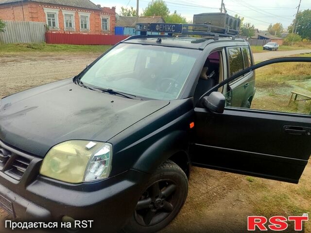 Черный Ниссан ИксТрейл, объемом двигателя 2.2 л и пробегом 357 тыс. км за 4000 $, фото 1 на Automoto.ua