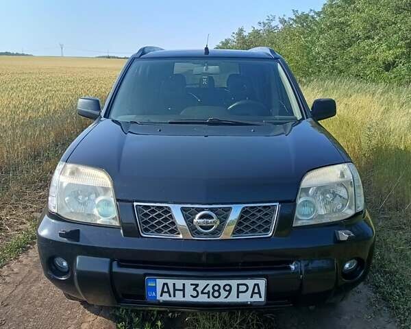 Черный Ниссан ИксТрейл, объемом двигателя 2.49 л и пробегом 320 тыс. км за 6000 $, фото 1 на Automoto.ua