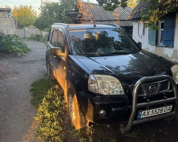 Черный Ниссан ИксТрейл, объемом двигателя 2 л и пробегом 287 тыс. км за 6300 $, фото 1 на Automoto.ua