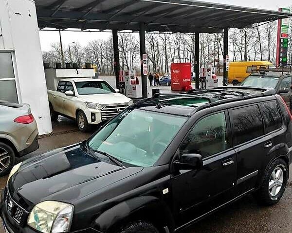 Черный Ниссан ИксТрейл, объемом двигателя 2.2 л и пробегом 100 тыс. км за 5500 $, фото 1 на Automoto.ua