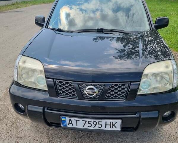 Черный Ниссан ИксТрейл, объемом двигателя 2.18 л и пробегом 210 тыс. км за 6400 $, фото 1 на Automoto.ua