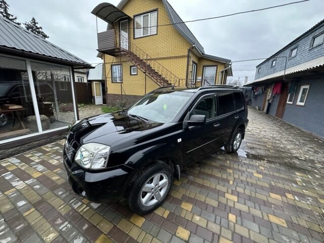 Черный Ниссан ИксТрейл, объемом двигателя 2.2 л и пробегом 168 тыс. км за 6699 $, фото 1 на Automoto.ua