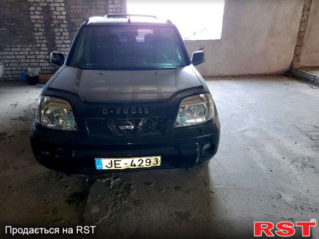 Черный Ниссан ИксТрейл, объемом двигателя 2.2 л и пробегом 320 тыс. км за 3500 $, фото 1 на Automoto.ua