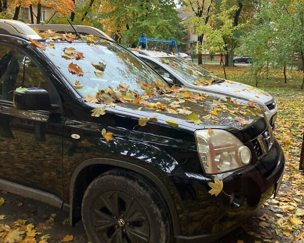 Черный Ниссан ИксТрейл, объемом двигателя 2 л и пробегом 257 тыс. км за 9147 $, фото 1 на Automoto.ua