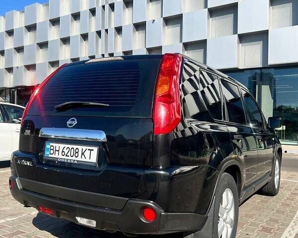 Черный Ниссан ИксТрейл, объемом двигателя 2 л и пробегом 190 тыс. км за 8700 $, фото 1 на Automoto.ua