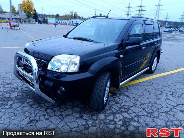 Черный Ниссан ИксТрейл, объемом двигателя 2.5 л и пробегом 170 тыс. км за 8600 $, фото 1 на Automoto.ua