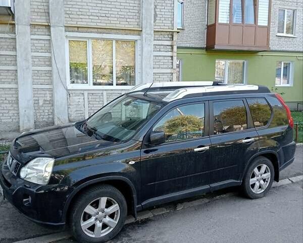 Черный Ниссан ИксТрейл, объемом двигателя 2 л и пробегом 276 тыс. км за 10800 $, фото 1 на Automoto.ua