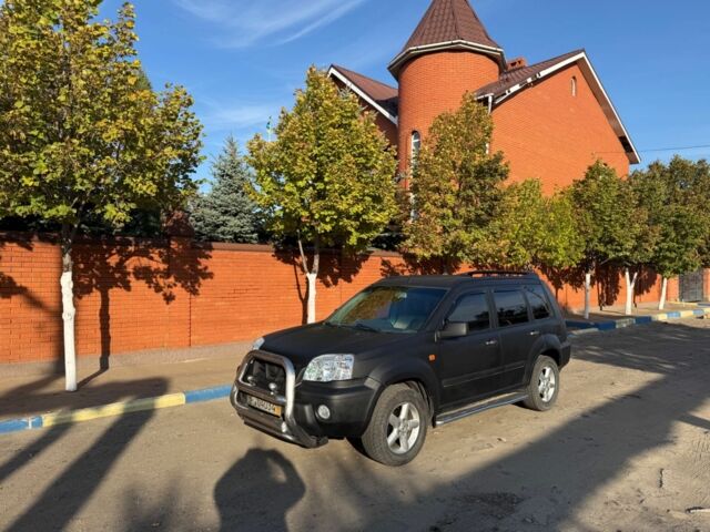 Черный Ниссан ИксТрейл, объемом двигателя 2 л и пробегом 200 тыс. км за 2950 $, фото 1 на Automoto.ua