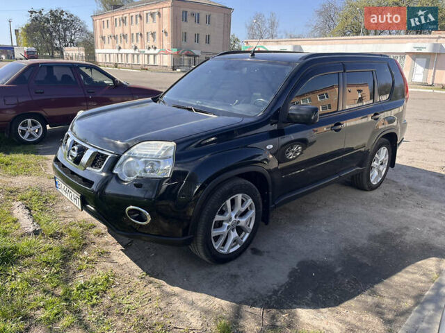 Черный Ниссан ИксТрейл, объемом двигателя 2.5 л и пробегом 172 тыс. км за 12200 $, фото 1 на Automoto.ua