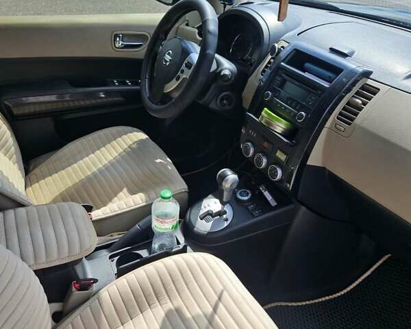 Черный Ниссан ИксТрейл, объемом двигателя 2.49 л и пробегом 171 тыс. км за 12300 $, фото 1 на Automoto.ua