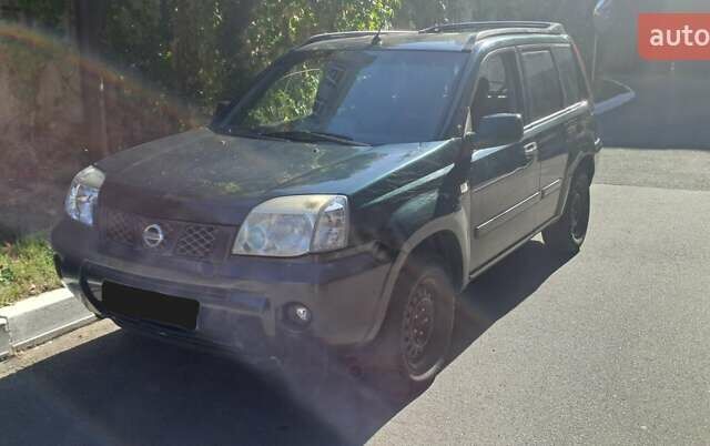 Зеленый Ниссан ИксТрейл, объемом двигателя 2.5 л и пробегом 309 тыс. км за 4842 $, фото 1 на Automoto.ua